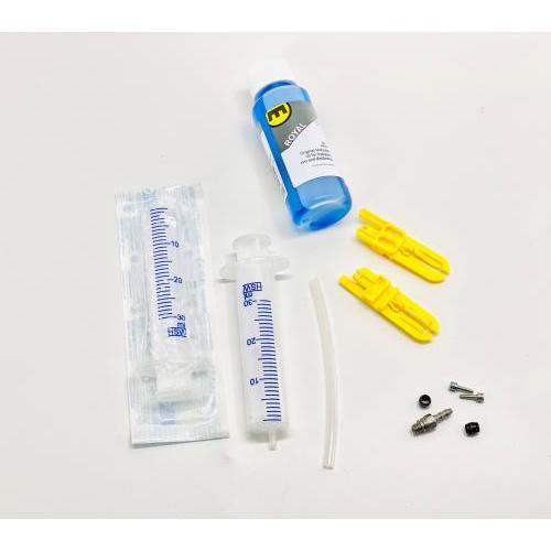 Collection of brake supplies including a syringe, plunger, and connectors on a white background