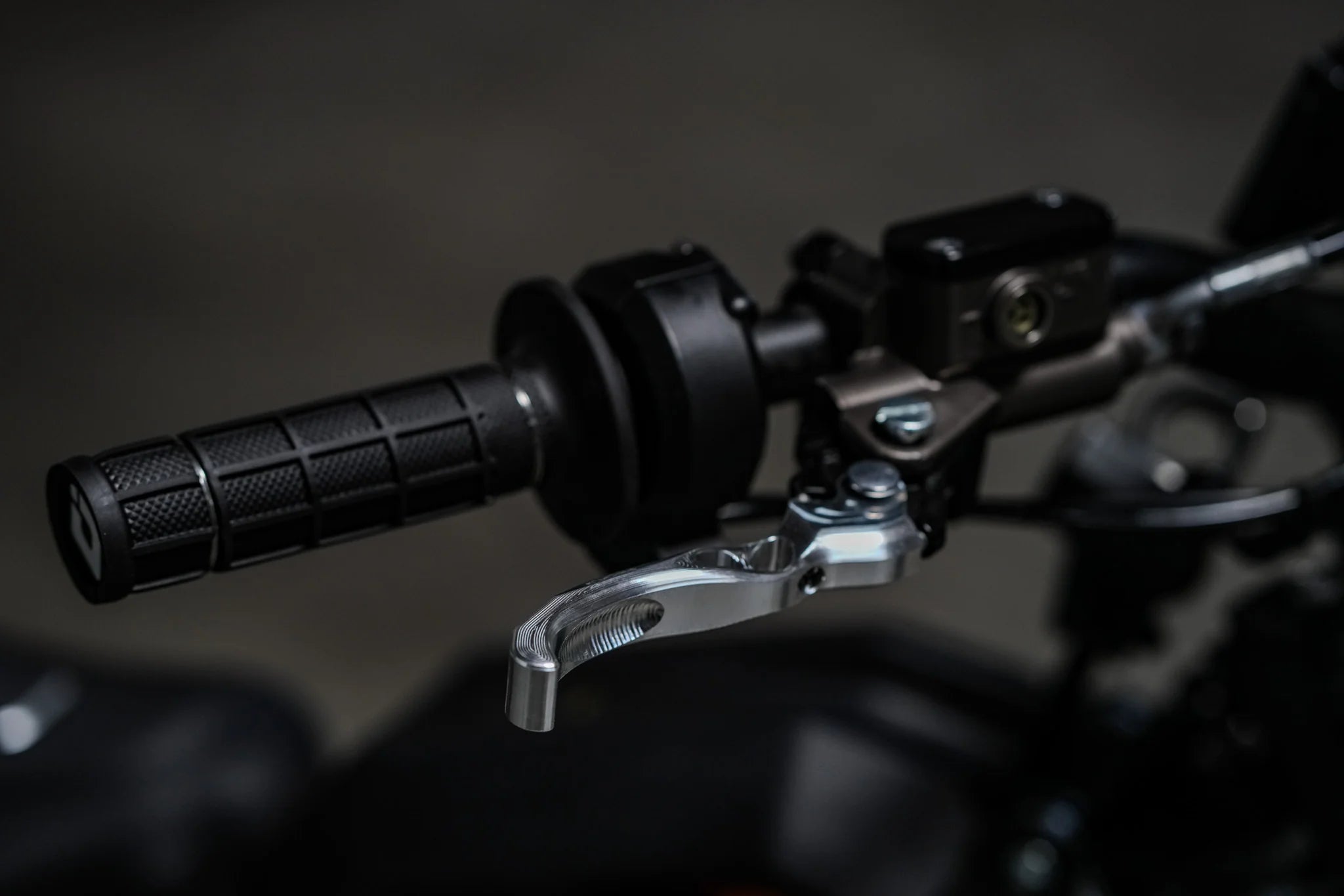 Prickly Motorsports brake lever close-up on a blurred background